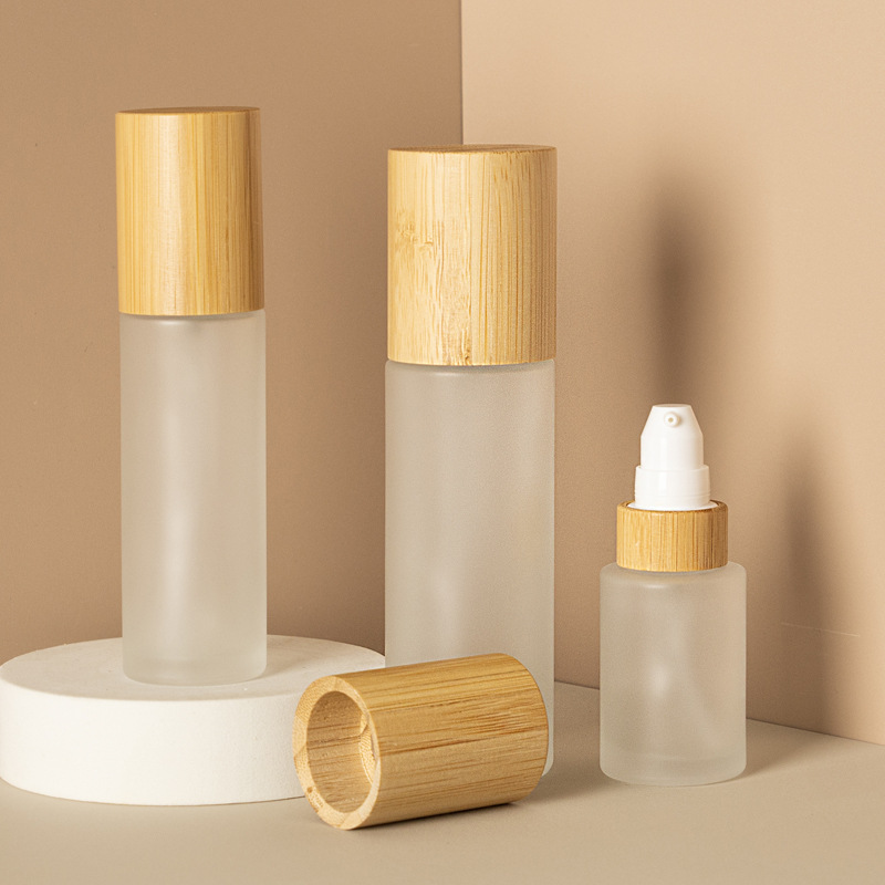 Frosted Cosmetic Lotion Pump Fine Mist And Lotion Glass Spray Bottle With Bamboo Wood Lid