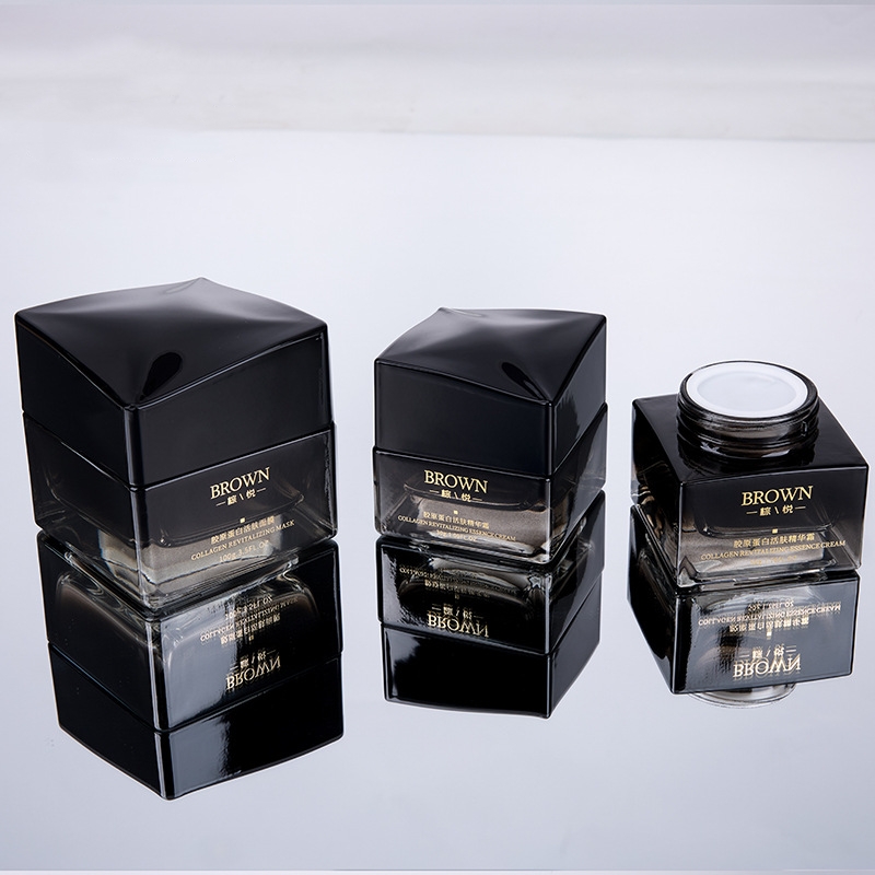 Jedinstvena četvrtasta staklena posuda za kremu s podignutim poklopcem za pakiranje kozmetike Jedinstvena četvrtasta staklena posuda za kremu s podignutim poklopcem za pakiranje kozmetike