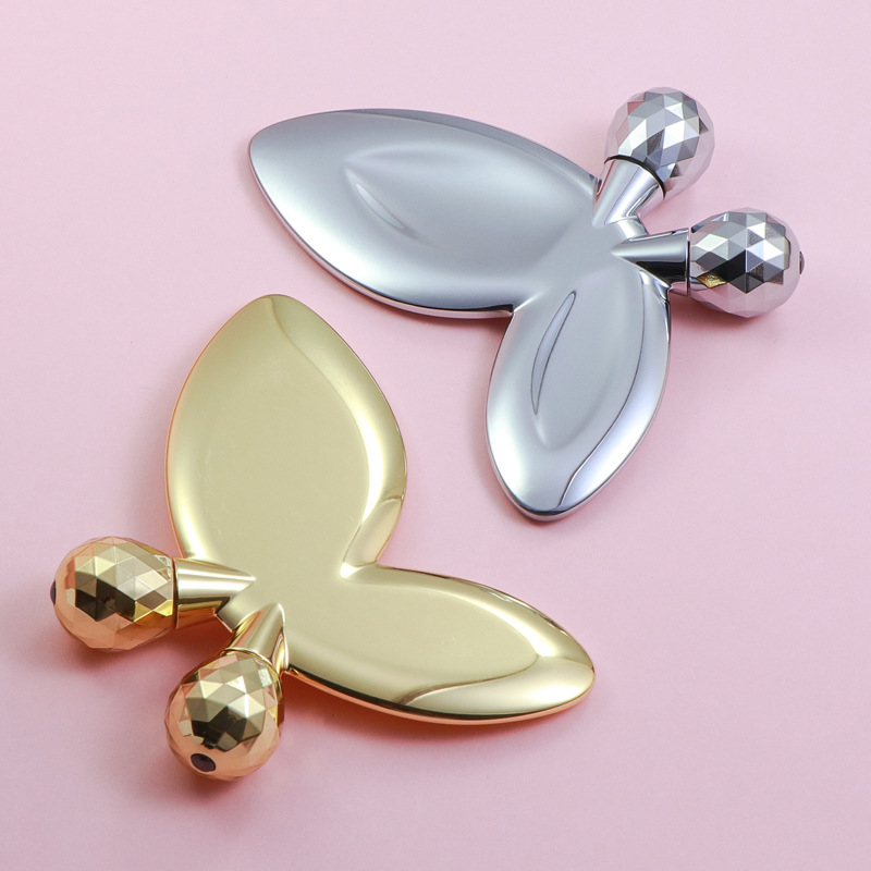 Valjak za masažu lica od legure cinka u obliku leptira